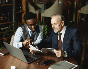 tow businessmen reviewing a contract
