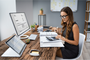 Business Owner doing business taxes at her desk