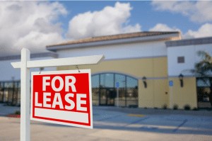 storefront with "for lease" sign