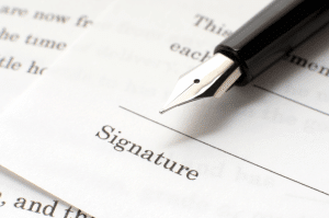 Pen on a contract signature line