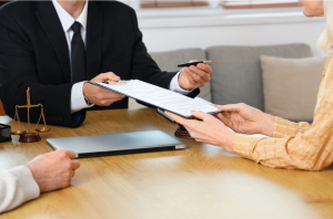 Couple signing uncontested Texas divorce agreement with an Austin family lawyer